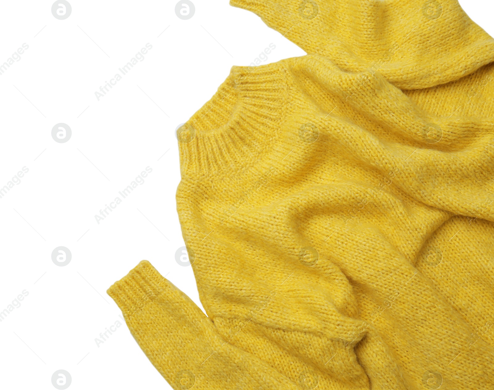 Photo of Warm yellow sweater on white background, top view