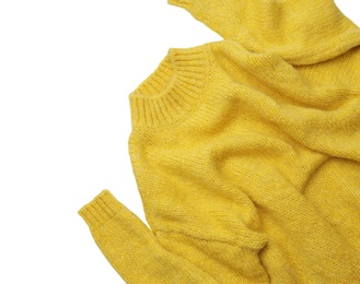 Warm yellow sweater on white background, top view