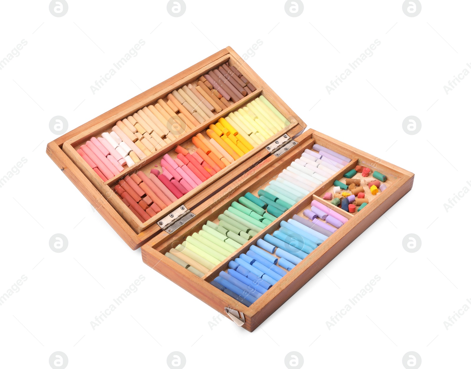 Photo of Set of soft pastels on white background in wooden box. Drawing material