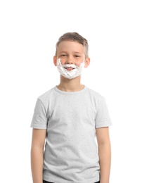 Photo of Happy boy with shaving foam on face against white background