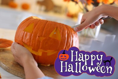Image of Happy Halloween. Woman making pumpkin jack o'lantern at table in kitchen, closeup