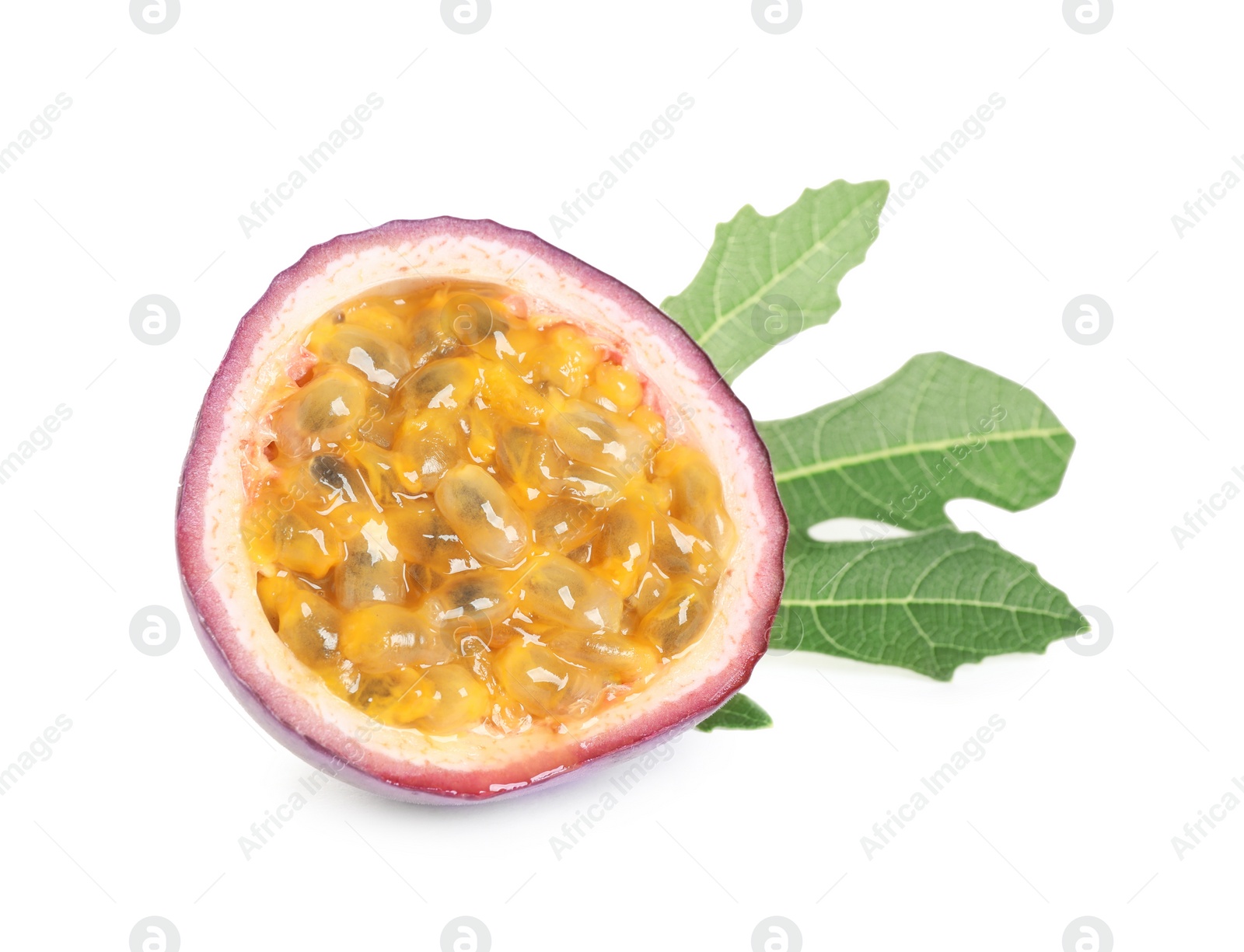 Photo of Half of fresh ripe passion fruit (maracuya) with green leaf isolated on white