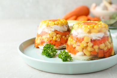 Delicious fish aspic served on light table, closeup