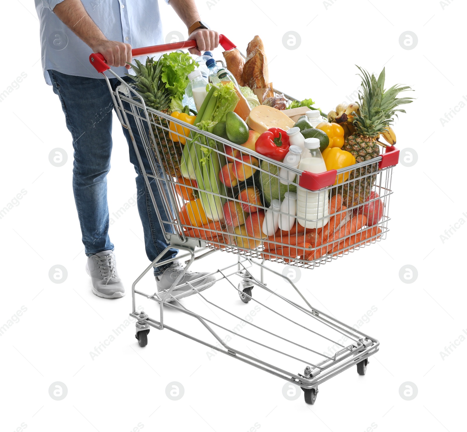 Photo of Man with shopping cart full of groceries on white background, closeup