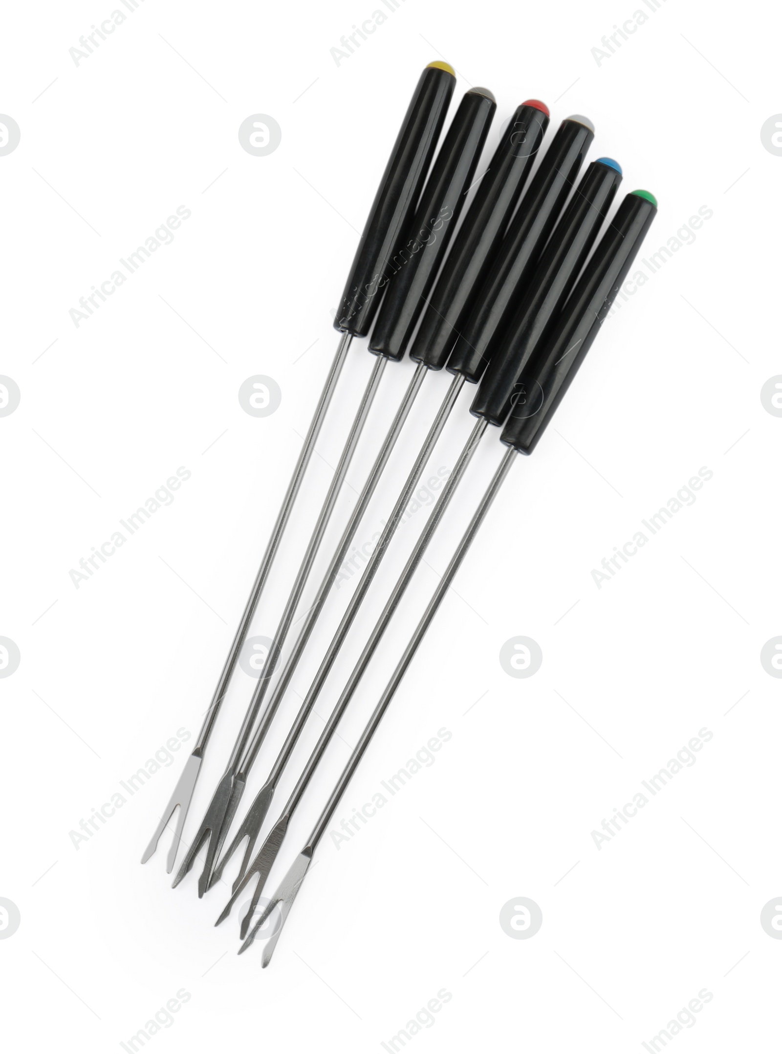 Photo of Set of fondue forks isolated on white, top view. Kitchen equipment