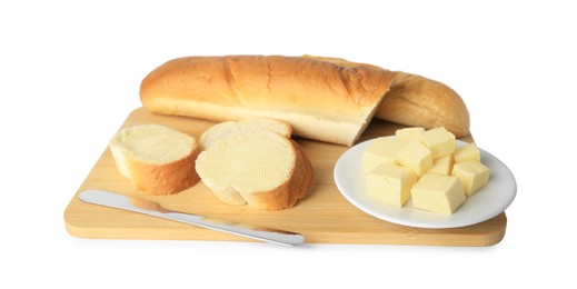 Photo of Whole and cut baguettes with fresh butter on white background