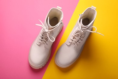 Pair of stylish leather shoes on color background, flat lay