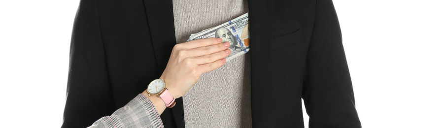 Image of Woman giving bribe money to man on white background, closeup. Banner design
