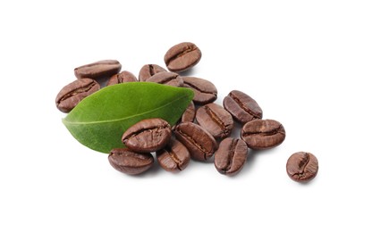 Photo of Roasted coffee beans and leaf isolated on white