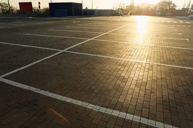 Photo of Car parking lots with white marking lines outdoors