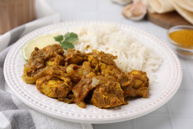 Photo of Delicious chicken curry with rice on table, closeup