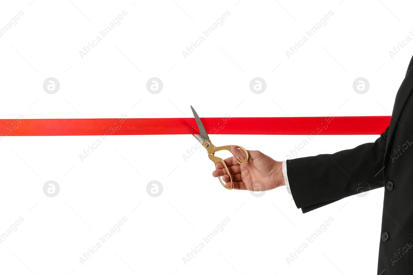 Photo of Man in office suit cutting red ribbon isolated on white, closeup