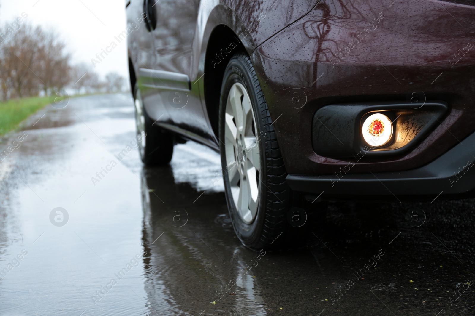 Photo of Car parked outdoors on rainy day, closeup