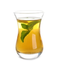Photo of Glass with hot aromatic mint tea on white background