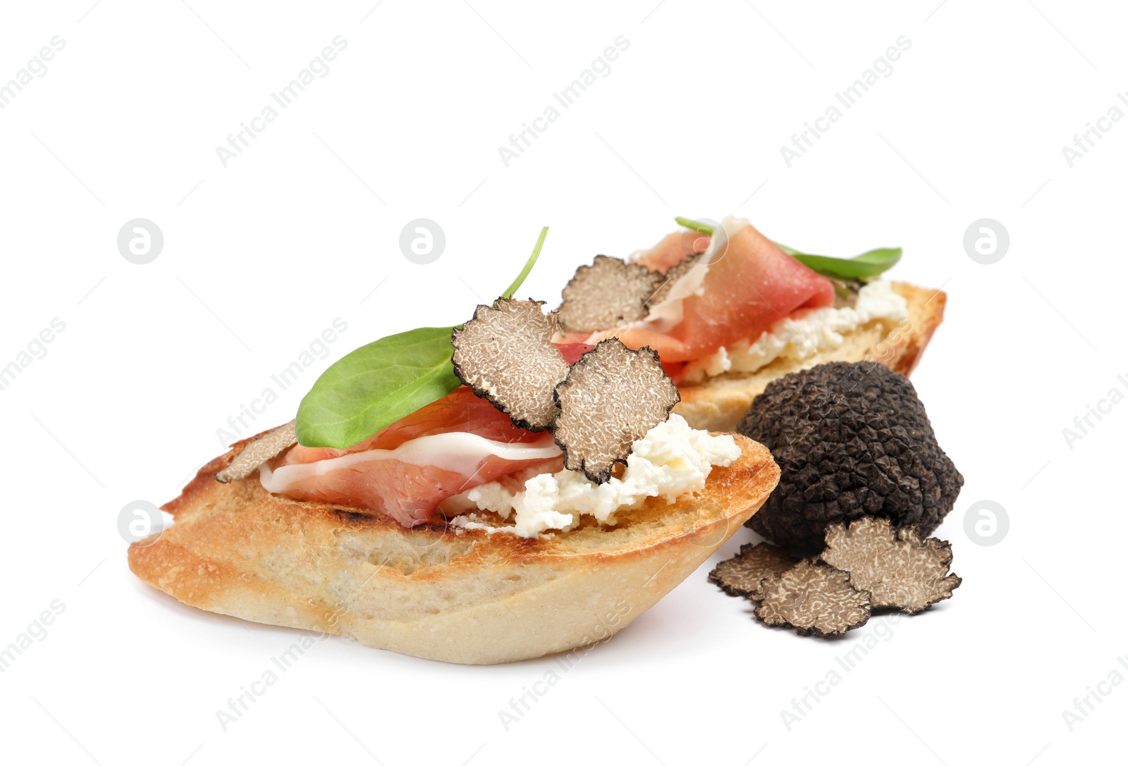 Photo of Tasty bruschettas with prosciutto and truffle on white background