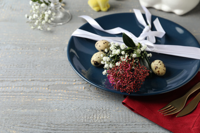 Photo of Festive Easter table setting with beautiful floral decor. Space for text