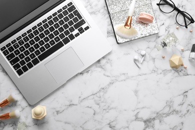 Flat lay composition with laptop on marble table. Beauty blogger's workplace