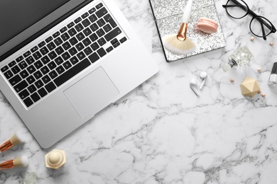 Photo of Flat lay composition with laptop on marble table. Beauty blogger's workplace