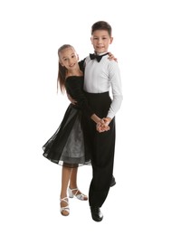 Photo of Beautifully dressed couple of kids dancing on white background