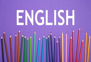 Colorful pencils on purple background, flat lay. Learn English