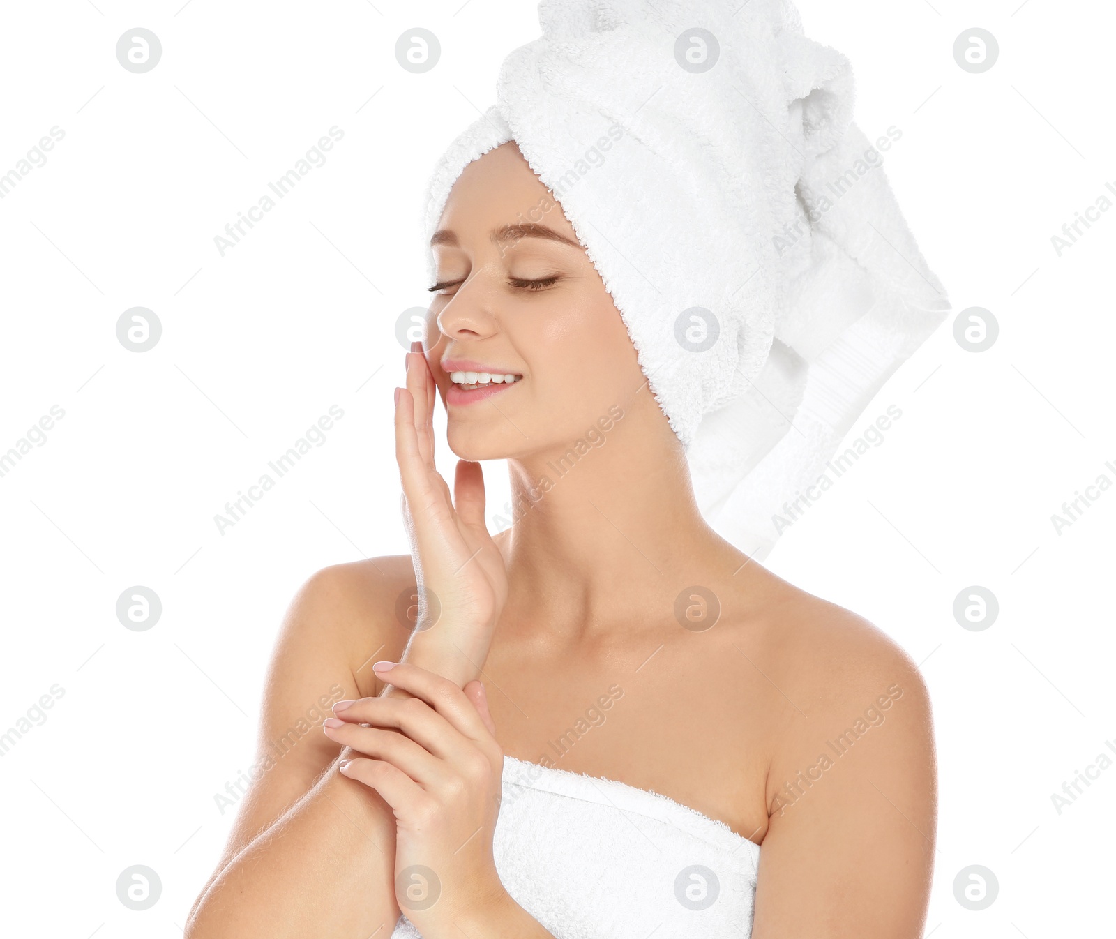 Photo of Portrait of young pretty woman with towels on white background