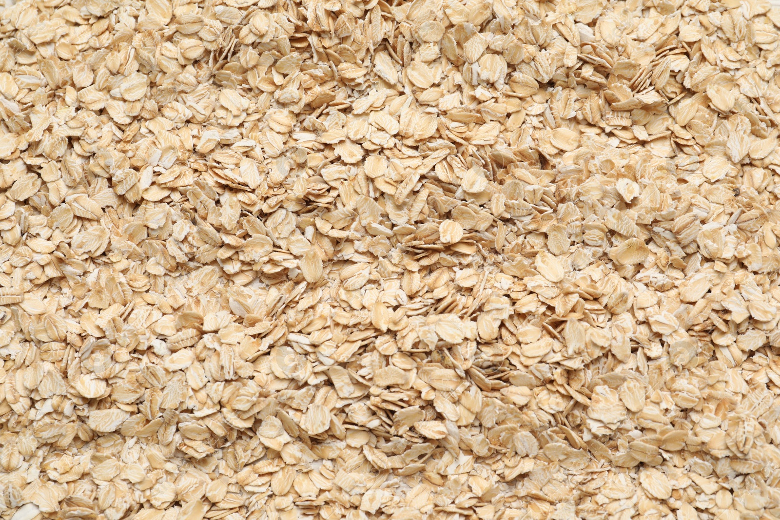 Photo of Top view of rolled oats as background