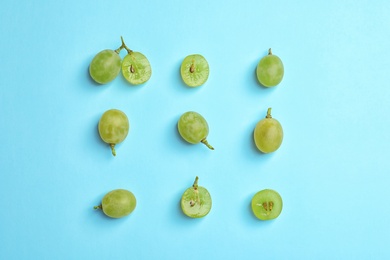 Photo of Fresh ripe juicy green grapes on color background, top view