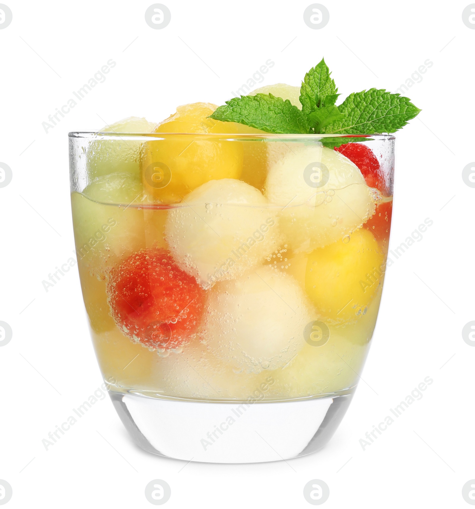 Photo of Glass of melon and watermelon ball cocktail with mint on white background