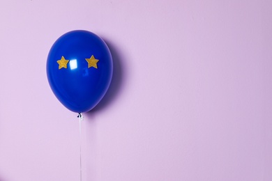 Photo of Blue balloon on color background. Celebration time