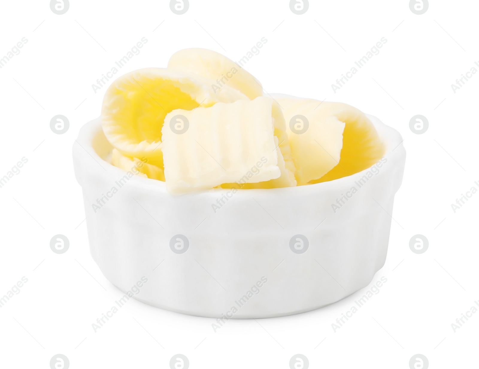 Photo of Tasty butter curls in bowl isolated on white