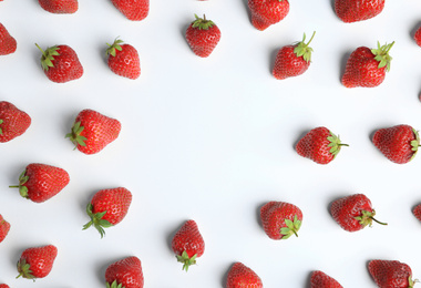 Photo of Tasty ripe strawberries on white background, flat lay. Space for text