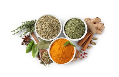 Different natural spices and herbs on white background, top view