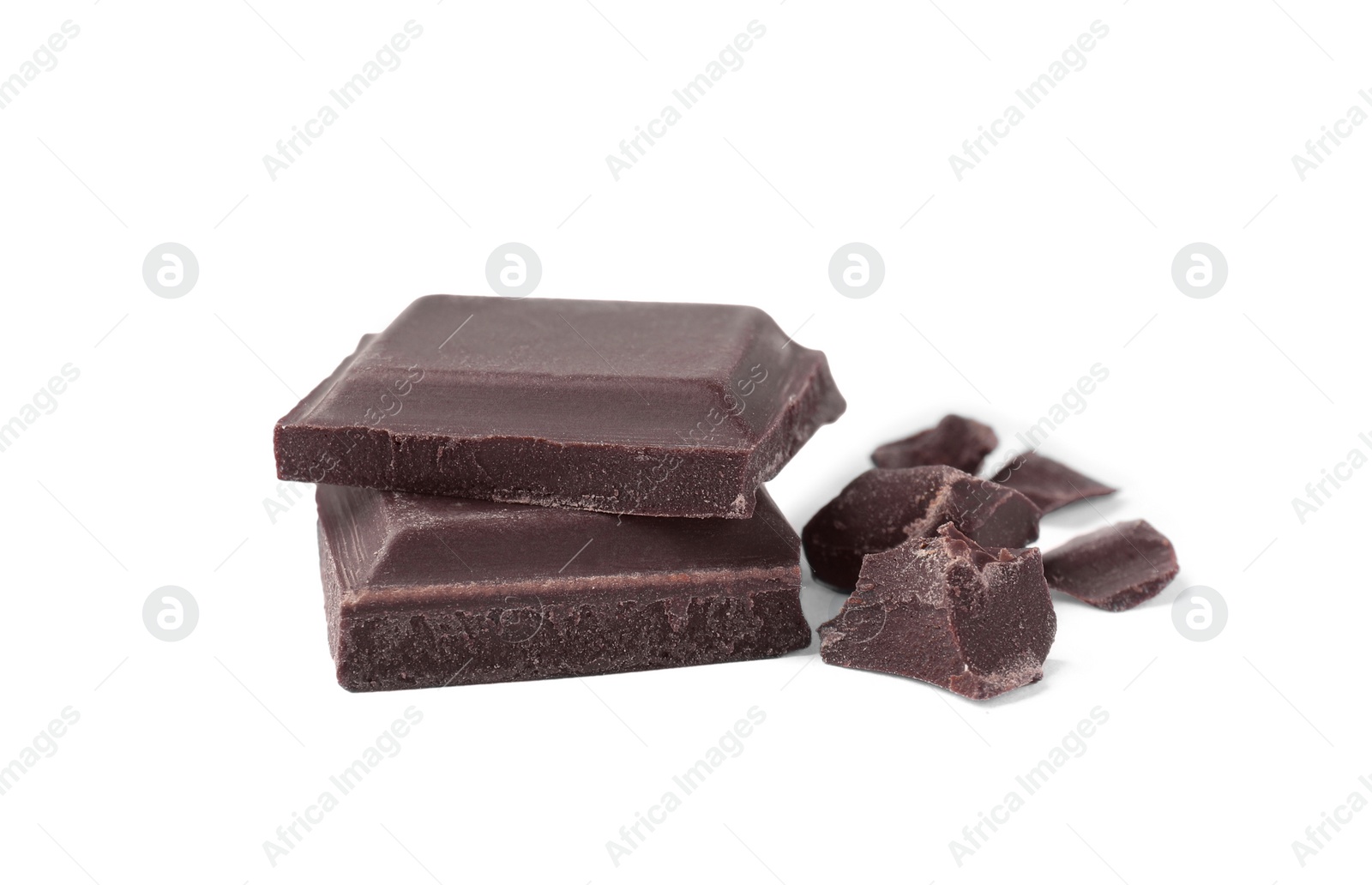 Photo of Pieces of delicious dark chocolate bar on white background