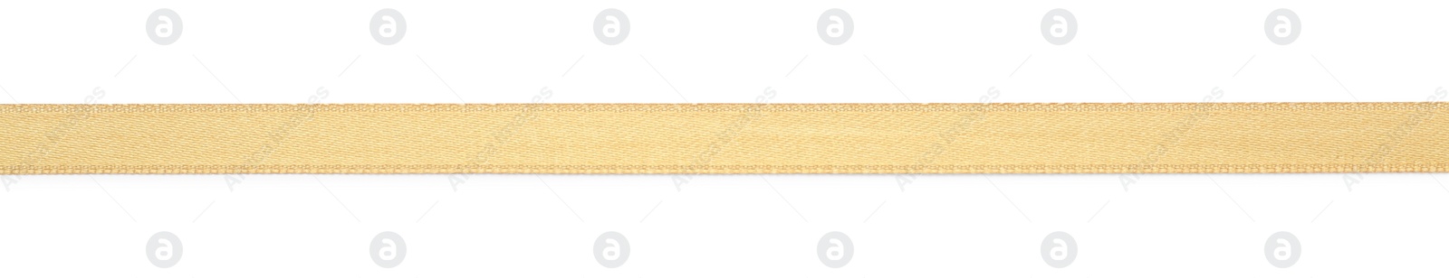 Photo of Beautiful golden ribbon isolated on white, top view