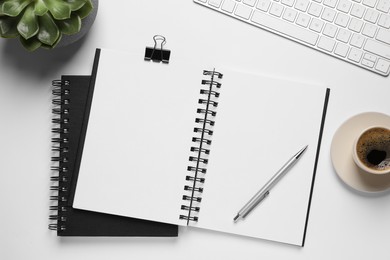 Photo of Flat lay composition with stylish notebooks on white table