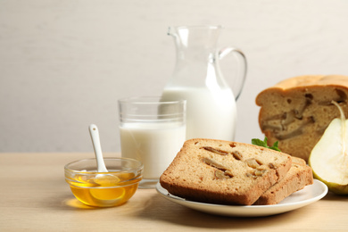 Composition with tasty pear bread on wooden table. Homemade cake