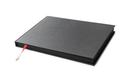 Photo of Stylish black hardcover notebook isolated on white