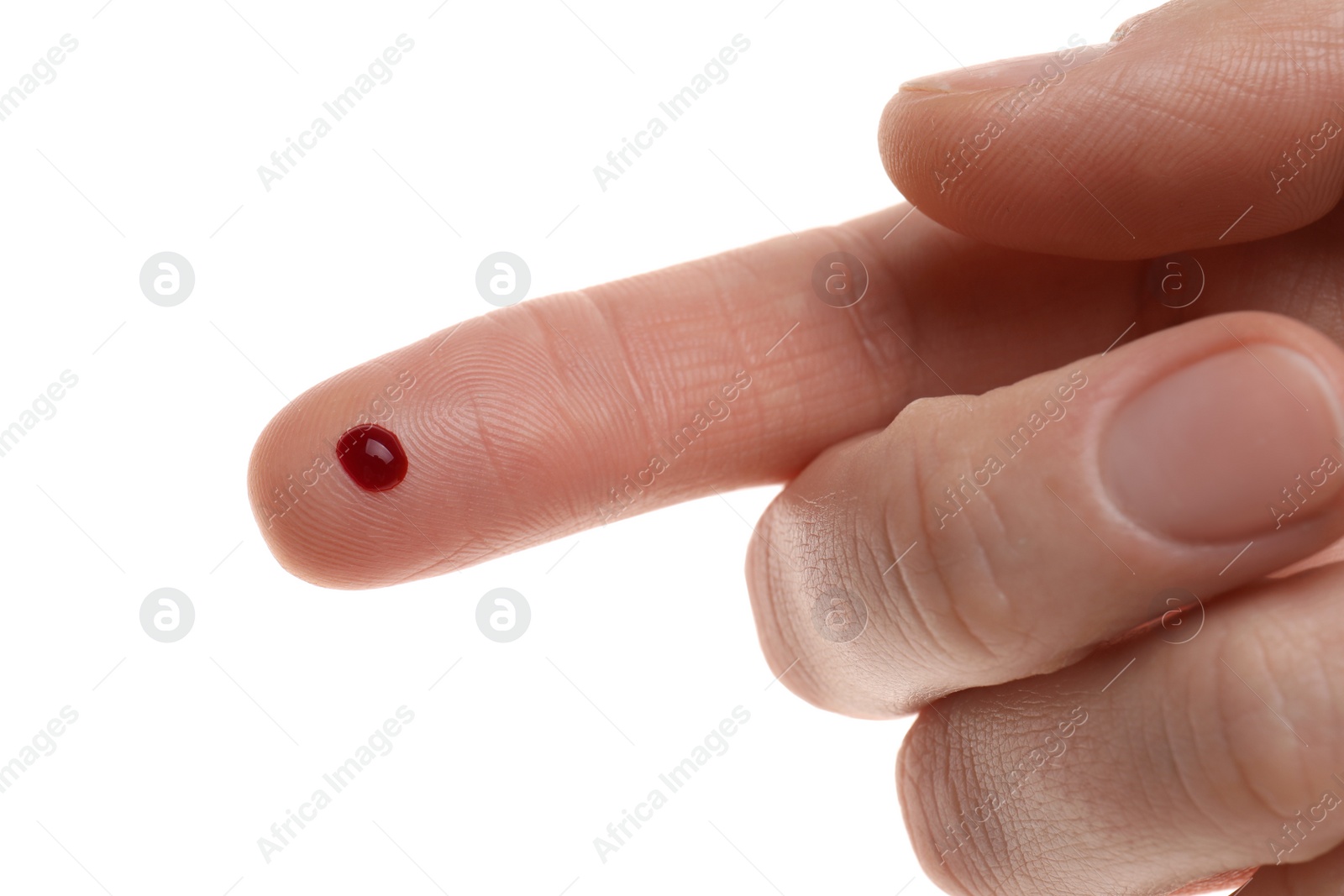 Photo of Woman with pricked finger and blood drop on white background, closeup