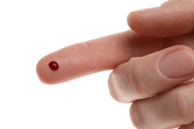 Photo of Woman with pricked finger and blood drop on white background, closeup