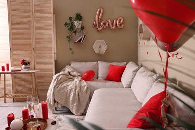 Photo of Cozy room decorated for Valentine's Day. Interior design