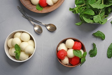 Photo of Flat lay composition with mint, melon and watermelon balls on grey background