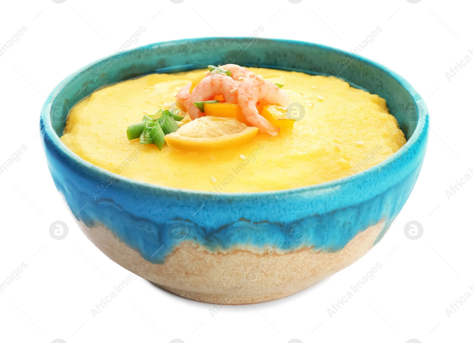 Photo of Bowl with tasty shrimps and grits on white background