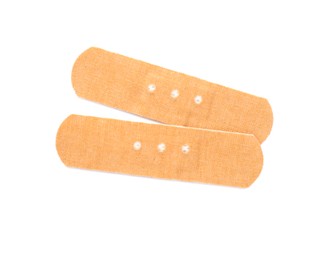 Photo of Sticking plasters isolated on white, top view. First aid item