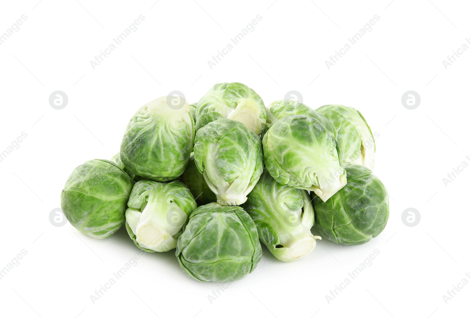 Photo of Pile of fresh Brussels sprouts isolated on white