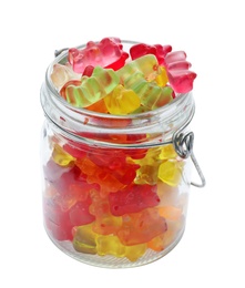 Glass jar with delicious jelly bears on white background