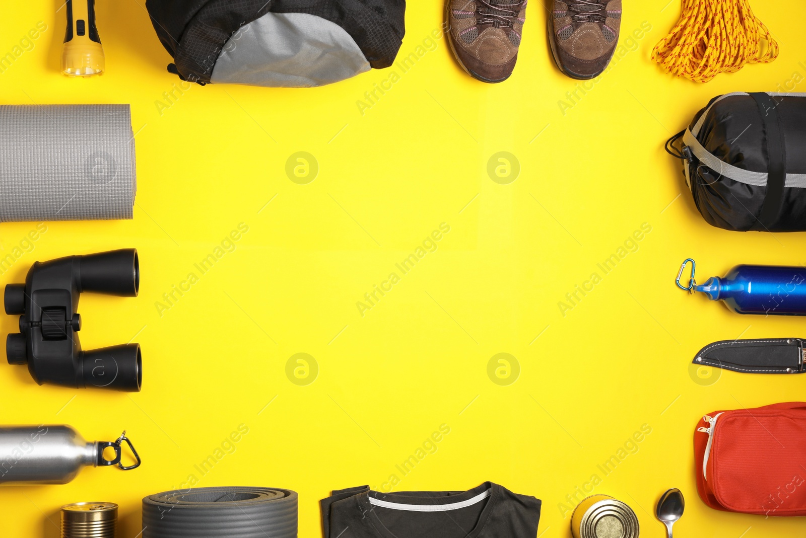 Photo of Flat lay composition with different camping equipment on color background, space for text