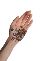 Photo of Woman with henna tattoo on palm against white background, closeup. Traditional mehndi ornament