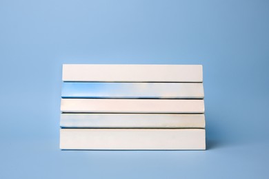 Collection of books on light blue background