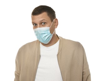 Mature man with protective mask feeling fear on white background