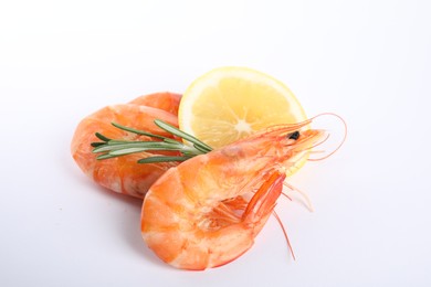 Delicious cooked shrimps, lemon and rosemary isolated on white